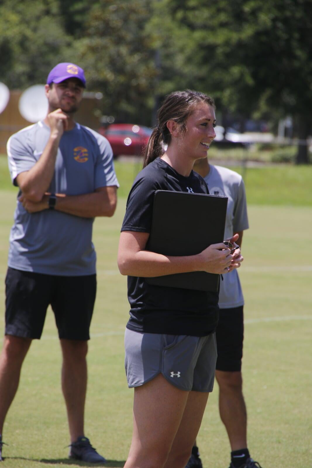 Female College Coach talking